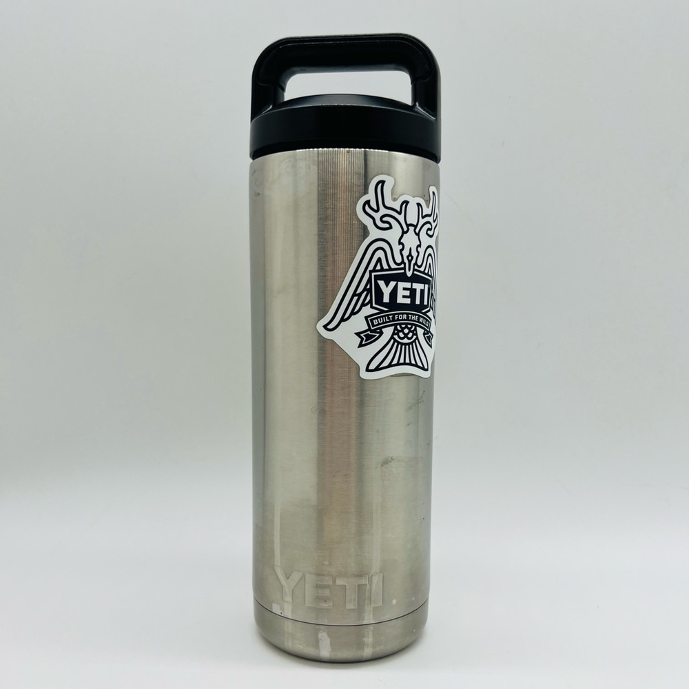 Yeti Silver Stainless Steel 18 Ounce Bottle with Black Handle and Logo Sticker